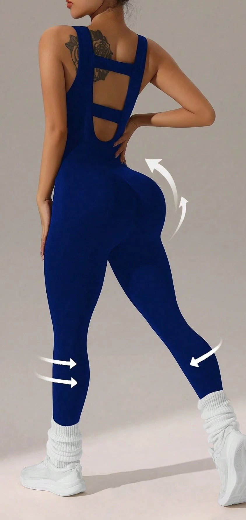 Blue full-length jumpsuit from behind, showing the strappy open back