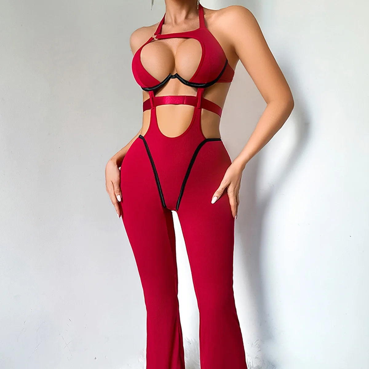 Burgundy cut-out halter catsuit, full-length front view, with black piping in a high-cut V and flared legs