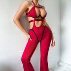 Side view of the burgundy catsuit showing the open waist and the fit over the hip